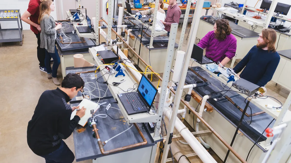 A group of engineering students working in science lab.