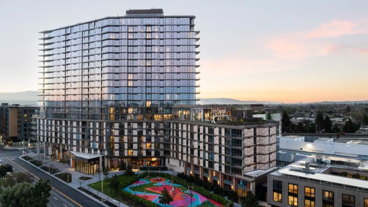 the exterior of a large luxury apartment building