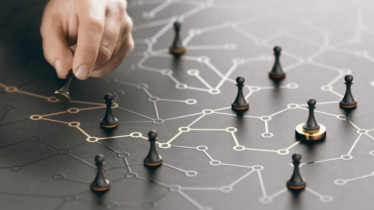 Hand moving pawn on a conceptual maze. Shortcut to success or career guidance concept. Composite image between a hand photography and a 3D background.