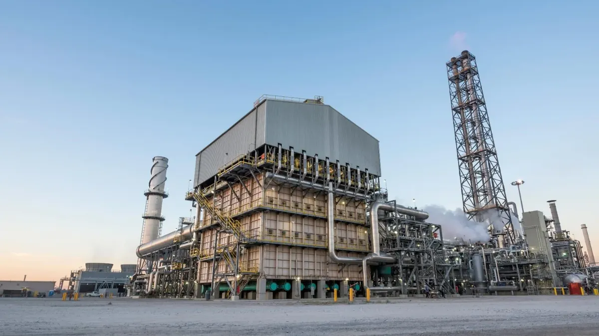 An ammonia factory in Louisiana stands against a blue sky.