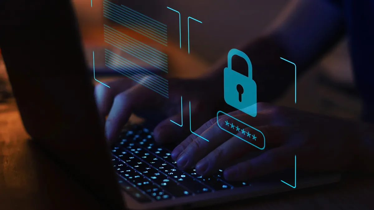 Image depicts the implementation of cybersecurity with a lock displayed over a screen.