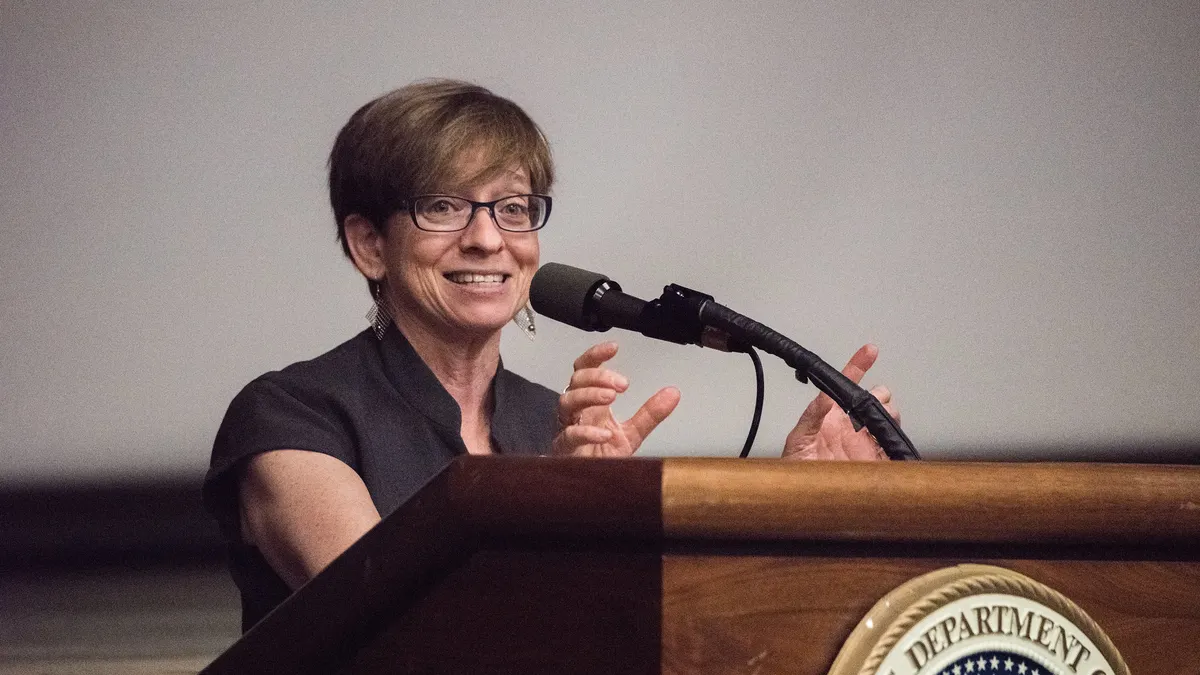 Former EEOC Commissioner Chai Feldblum speaks at podium