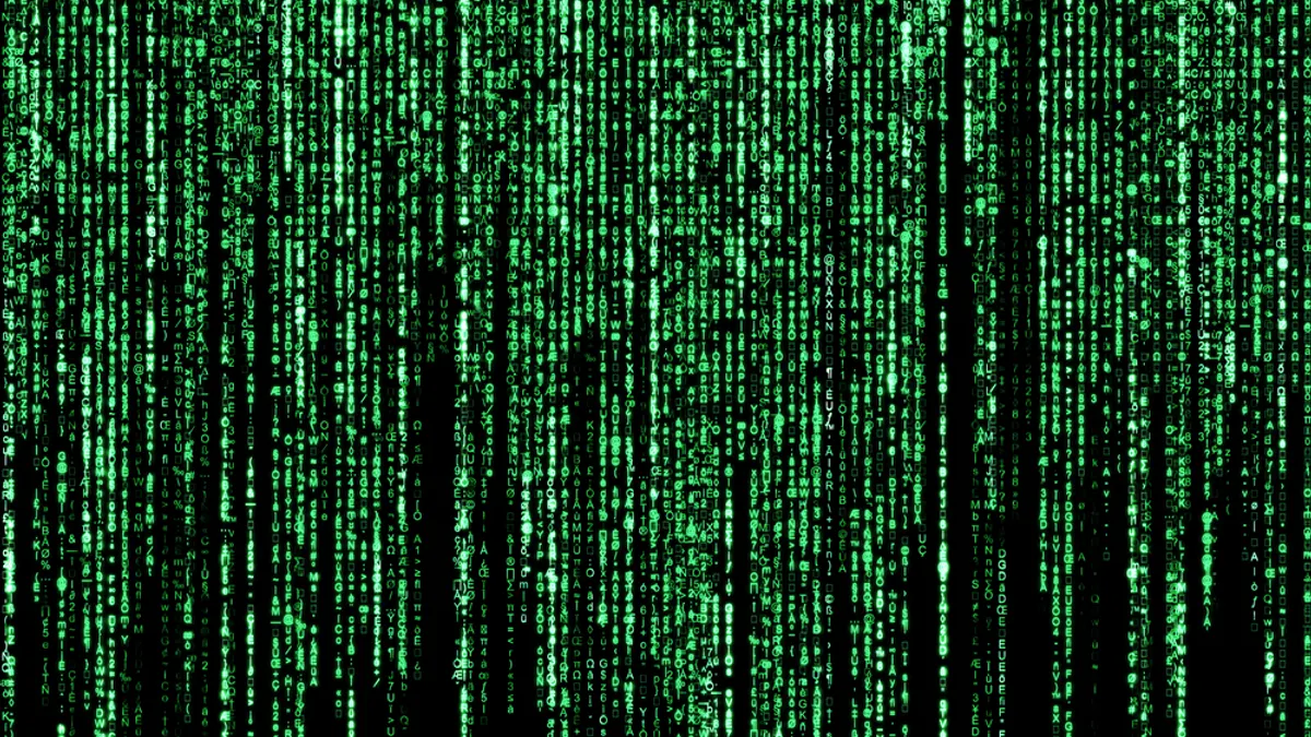 Matrix background of blurred programming code.