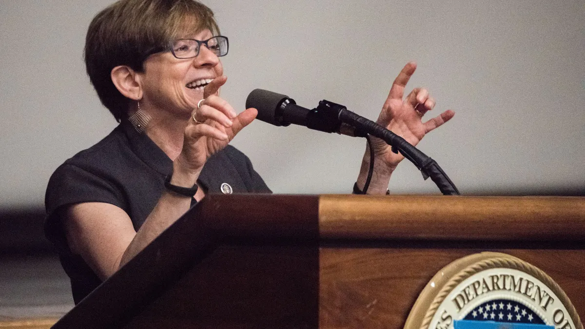Former EEOC Commissioner Chai Feldblum speaks at podium